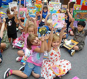 kids with their new books at book fair