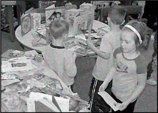 girl browses books at OCHO project book fair