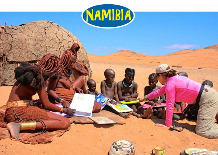 The Himba families in front of their desert home