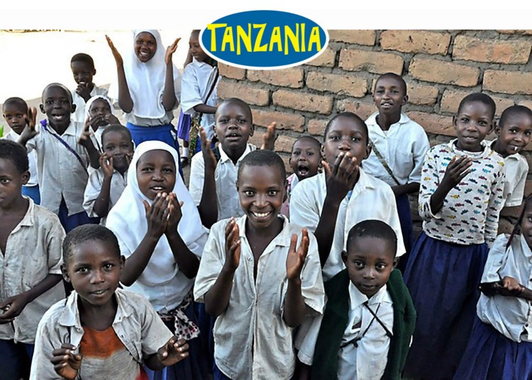 Tanzanian children smile and throw kisses to express their gratitude