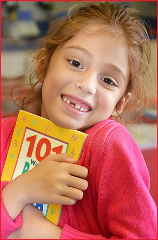 A girl holding a book with the number 1 0 1 on it.