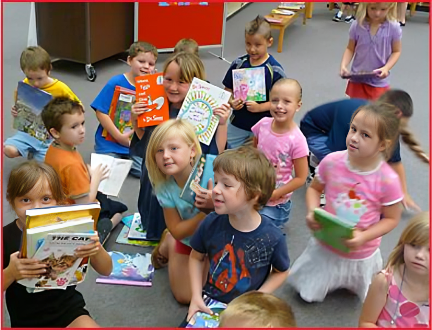 A group of children sitting around each other.