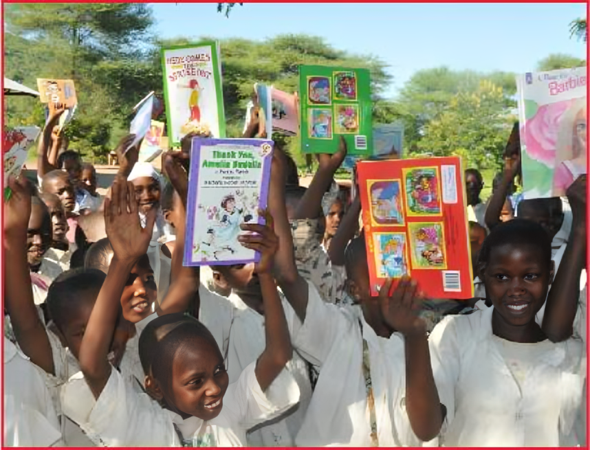 A group of children holding up books in the air.