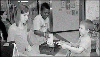 A black and white photo of two people handing out papers.